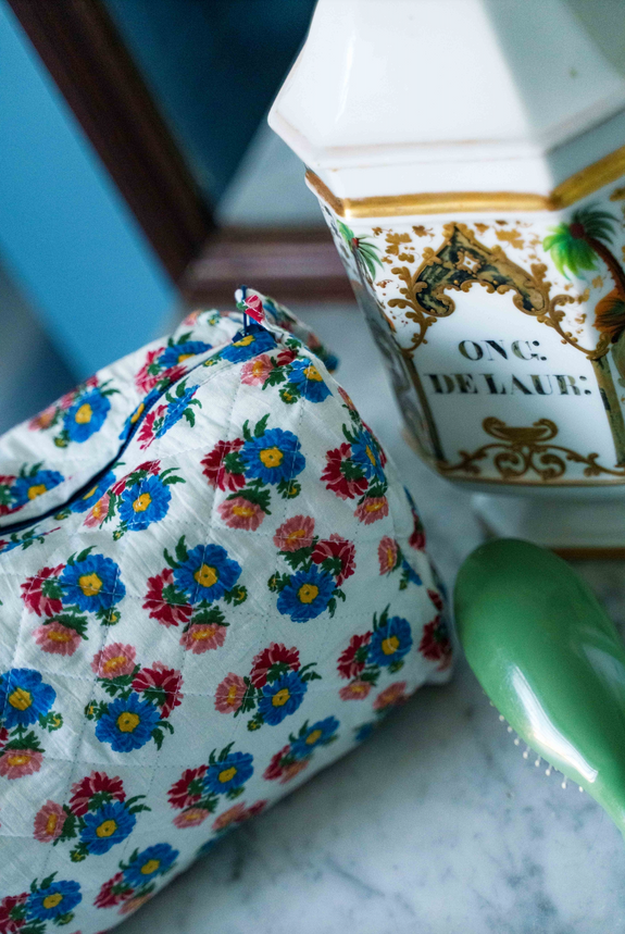 Round quilted toiletry bag