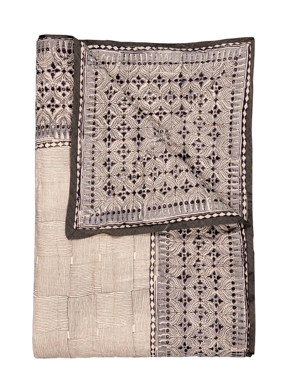 Reversible quilted blanket