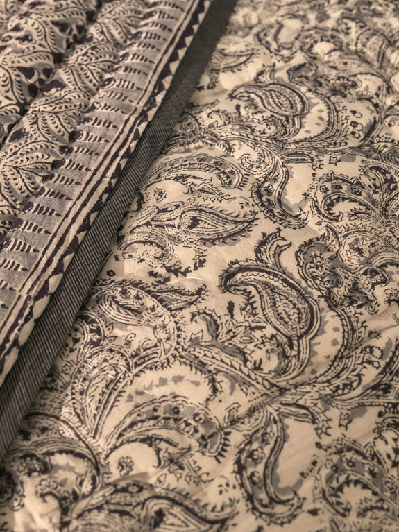 Reversible quilted blanket