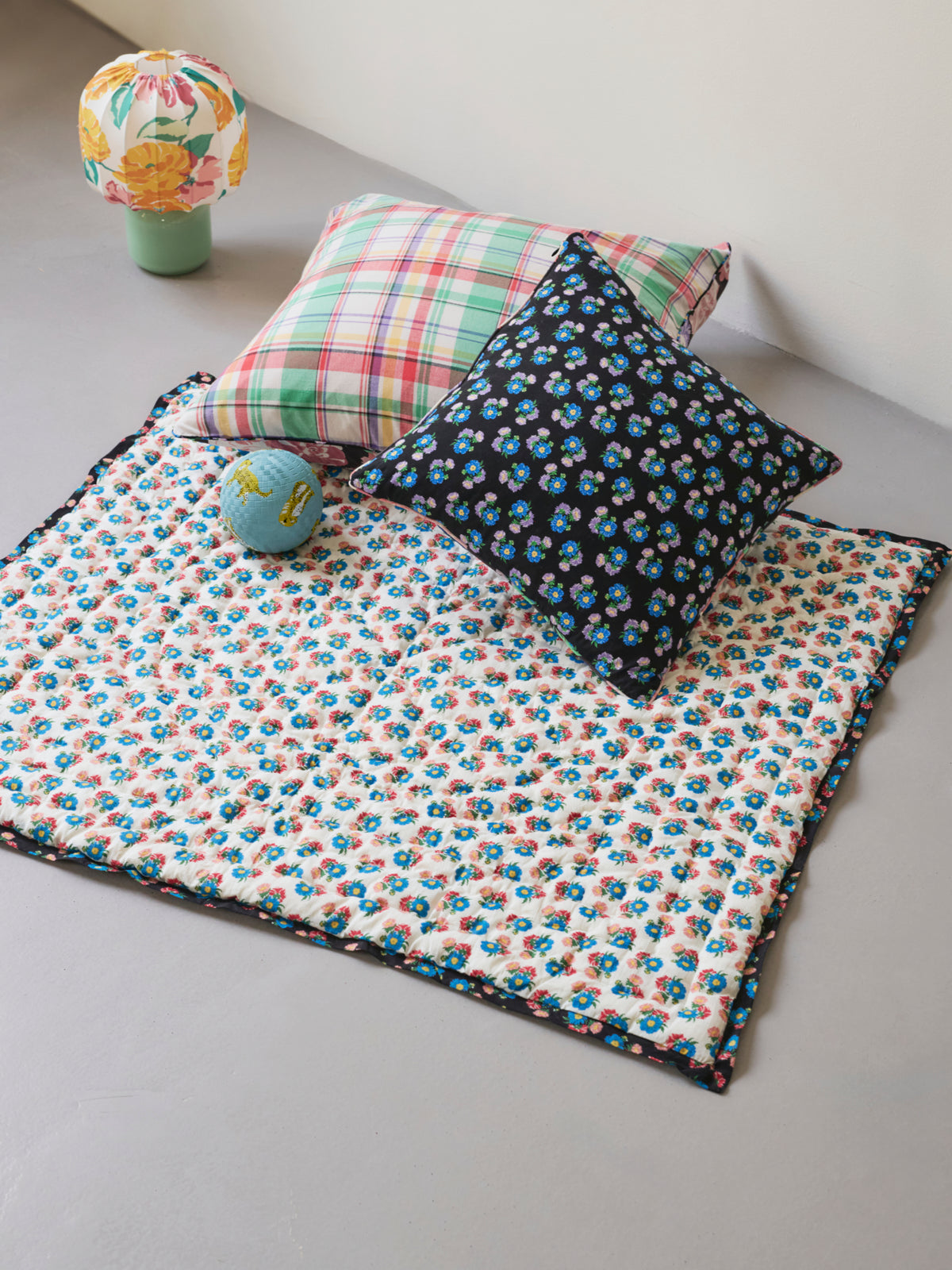 Reversible quilted play mat