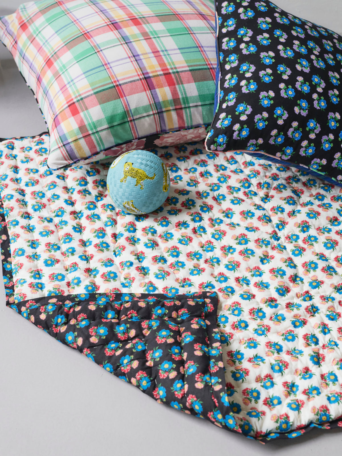 Reversible quilted play mat